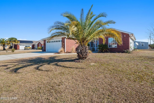 view of front of home featuring a garage, a front lawn, and solar panels