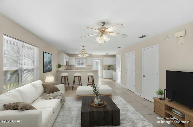 tiled living room featuring ceiling fan