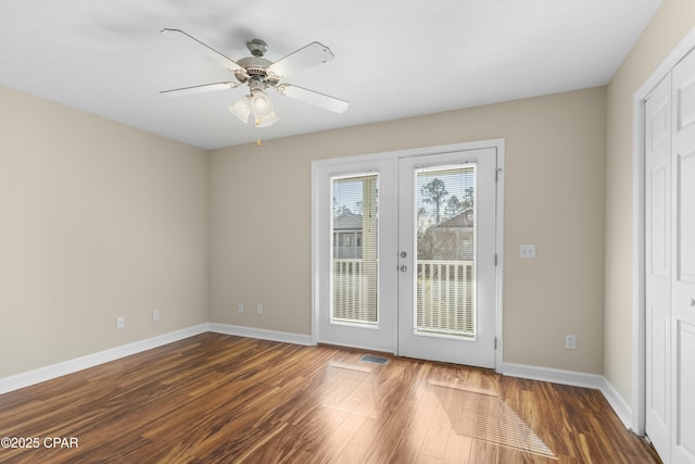 entryway with french doors, ceiling fan, and dark hardwood / wood-style floors