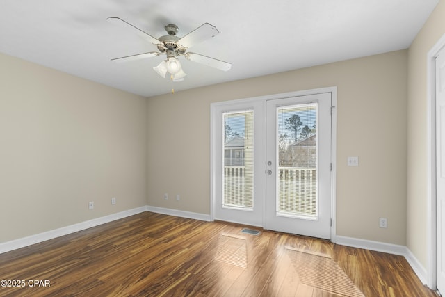 interior space with dark hardwood / wood-style flooring, french doors, and ceiling fan