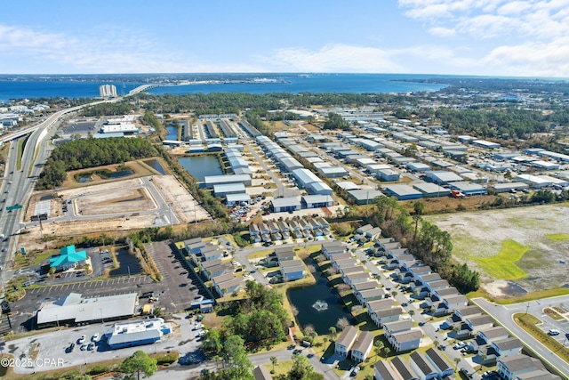 drone / aerial view with a water view