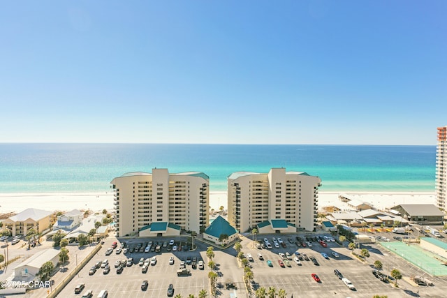 drone / aerial view featuring a water view and a view of the beach