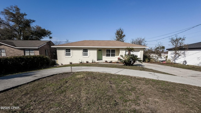 view of front of home featuring a garage and a front lawn