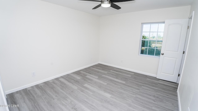 empty room with wood-type flooring and ceiling fan