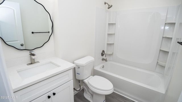 full bathroom featuring hardwood / wood-style floors, vanity, toilet, and  shower combination