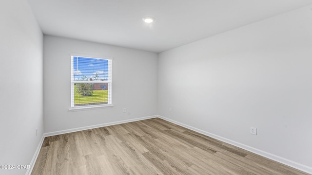 unfurnished room with light hardwood / wood-style flooring