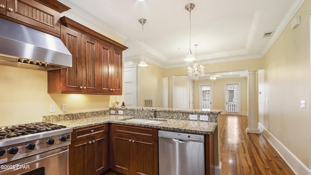 kitchen featuring decorative columns, visible vents, appliances with stainless steel finishes, under cabinet range hood, and a sink