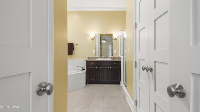 full bathroom featuring ornamental molding, a garden tub, tile patterned flooring, vanity, and a shower stall