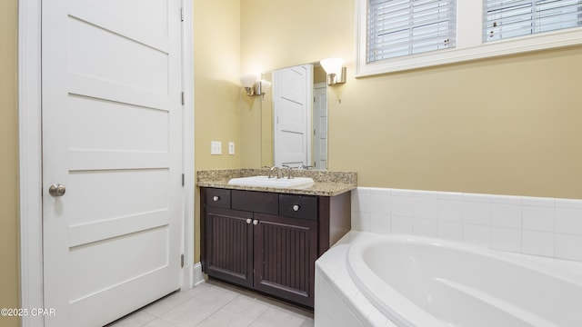 full bath featuring tile patterned floors, a bath, and vanity