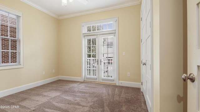 unfurnished room featuring ornamental molding, french doors, carpet floors, and baseboards