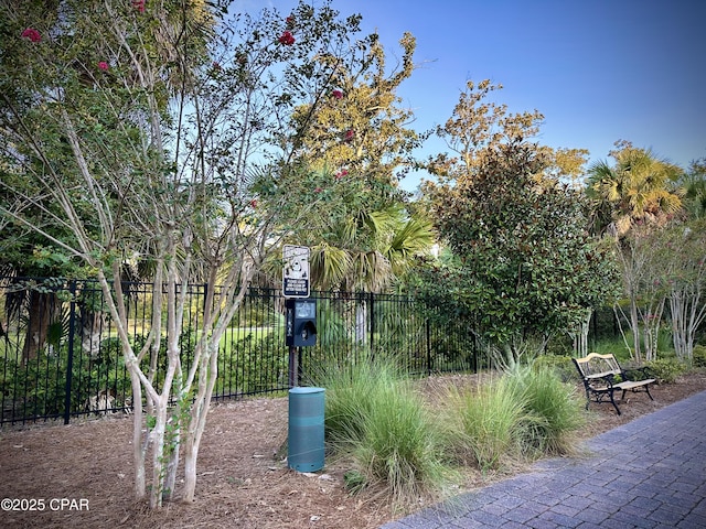 view of community with fence