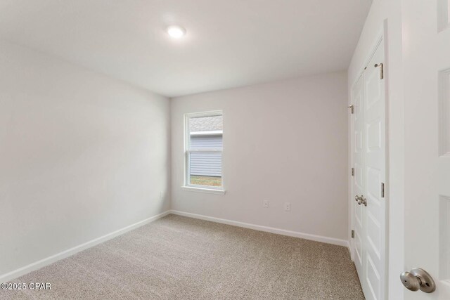 unfurnished room featuring carpet floors