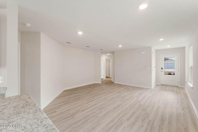 unfurnished living room with light hardwood / wood-style flooring