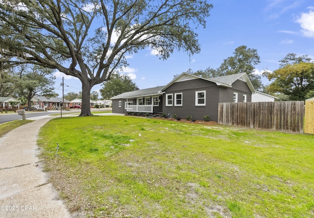 view of side of property with a yard