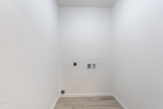 clothes washing area featuring laundry area, hookup for an electric dryer, light wood-style floors, baseboards, and washer hookup