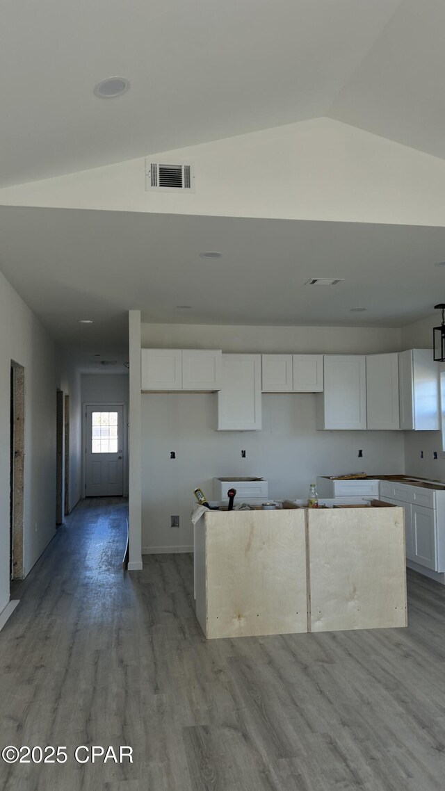 unfurnished room with ceiling fan and light wood-type flooring