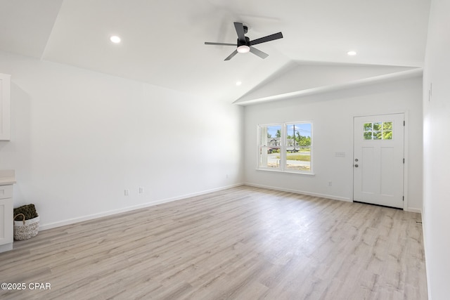 unfurnished living room featuring vaulted ceiling, ceiling fan, light wood-style flooring, baseboards, and recessed lighting