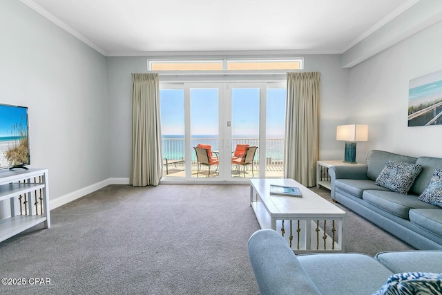 living area featuring a water view, crown molding, baseboards, and carpet floors