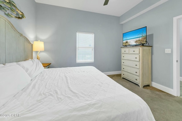bedroom with a ceiling fan, carpet flooring, and baseboards