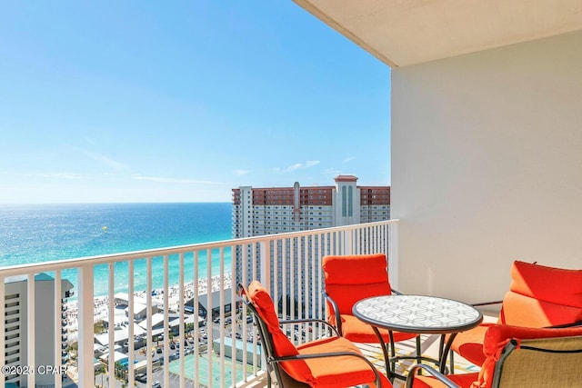 balcony with a view of the beach and a water view