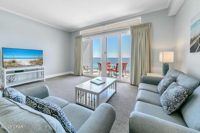 living room featuring carpet, ornamental molding, a water view, and baseboards