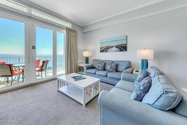 9860 S Thomas Dr Unit 2013, Panama City, FL 32408 - living area with light colored carpet, ornamental molding, a water view, and french doors