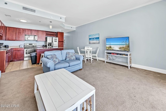 living room featuring visible vents, light colored carpet, crown molding, and baseboards