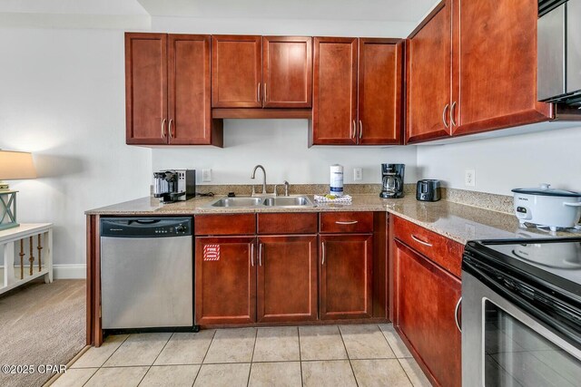 9860 S Thomas Dr Unit 2017, Panama City, FL 32408 - kitchen with appliances with stainless steel finishes, light stone counters, reddish brown cabinets, and light tile patterned floors