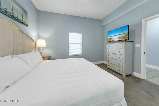 bedroom with carpet flooring and baseboards