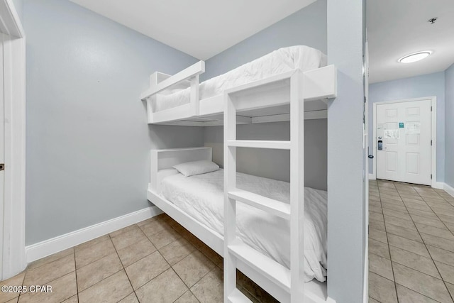 tiled bedroom with baseboards