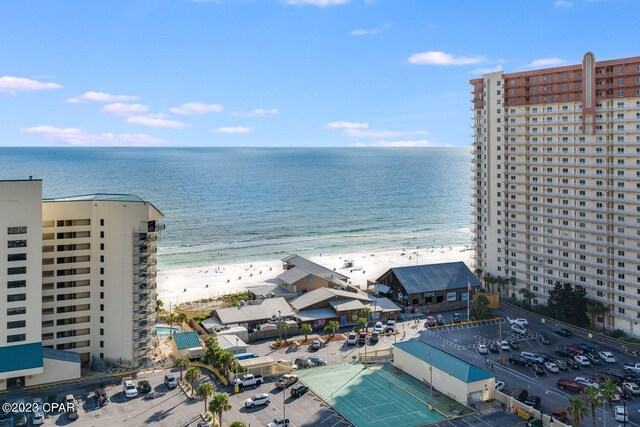 drone / aerial view featuring a view of the beach and a water view