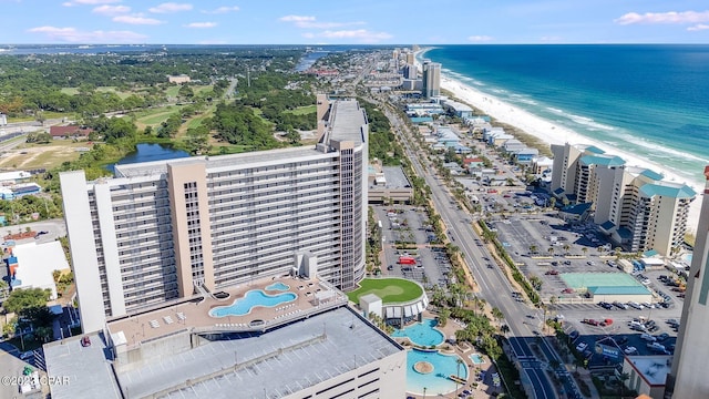 aerial view featuring a view of city, a beach view, and a water view