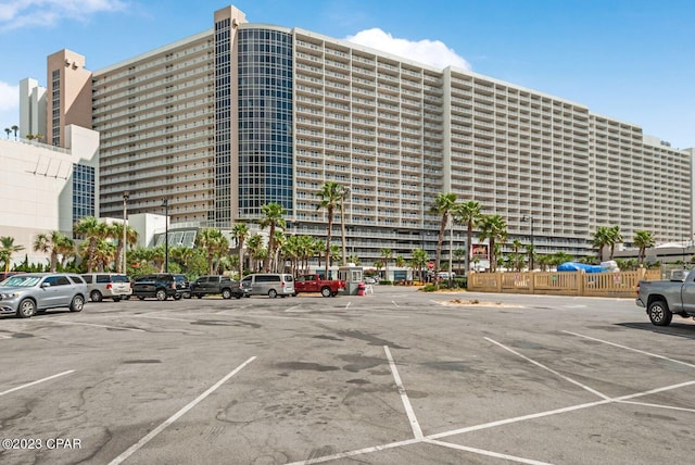 view of building exterior featuring uncovered parking