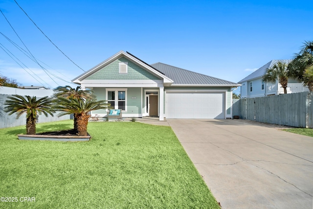 view of front facade featuring a porch, a garage, and a front yard