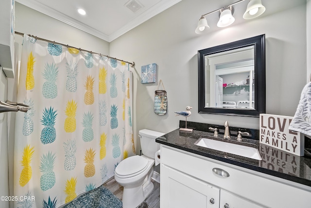 bathroom with crown molding, vanity, toilet, and hardwood / wood-style floors