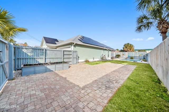 view of patio featuring a fenced in pool