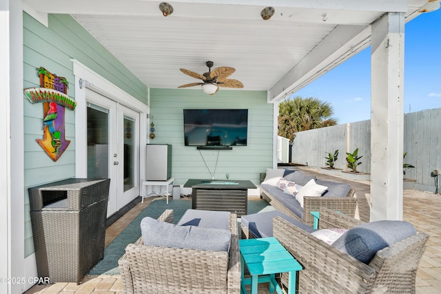 view of patio / terrace featuring french doors, ceiling fan, and an outdoor living space