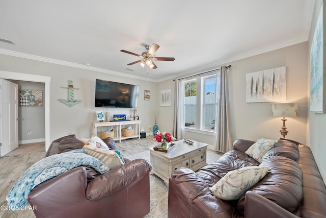 living room with light hardwood / wood-style flooring, ornamental molding, and ceiling fan