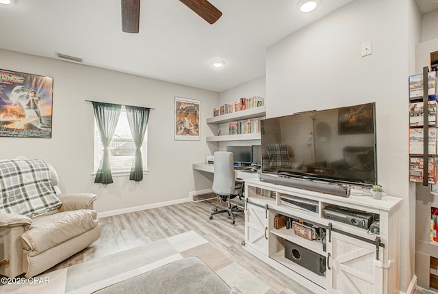 office area with ceiling fan and light hardwood / wood-style floors