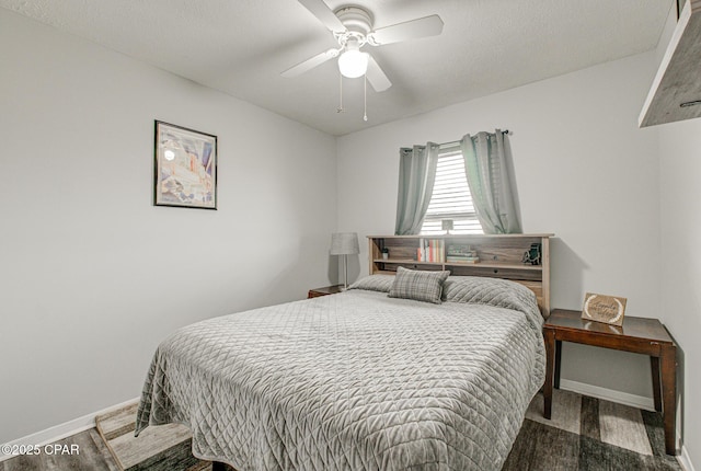 bedroom featuring wood-type flooring and ceiling fan