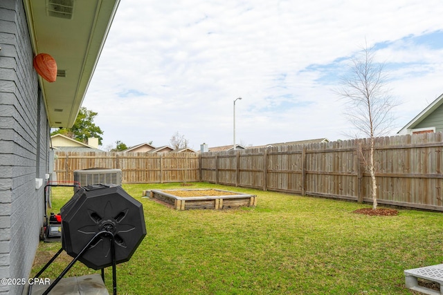 view of yard with central AC unit