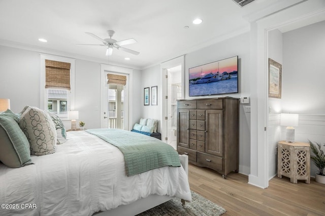 bedroom with crown molding, ceiling fan, connected bathroom, and light hardwood / wood-style floors