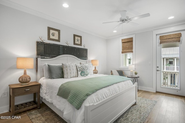 bedroom featuring crown molding, ceiling fan, and light hardwood / wood-style floors