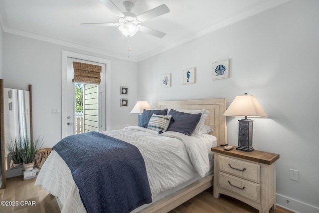 bedroom with ceiling fan, access to outside, ornamental molding, and wood-type flooring