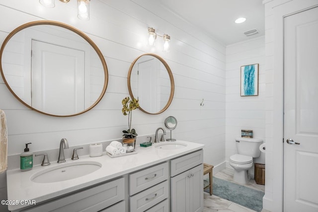 bathroom with vanity and toilet