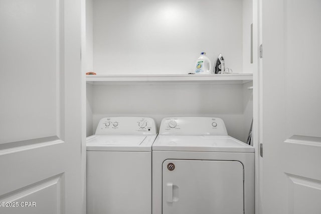 washroom with independent washer and dryer