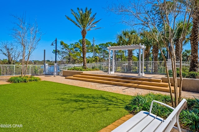 surrounding community with a gate, a pergola, a yard, and fence