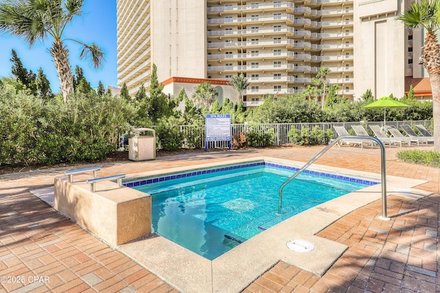 view of pool featuring a pool, a patio, and fence