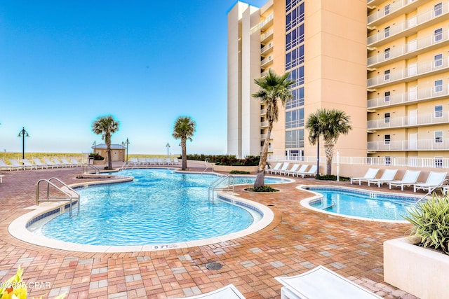 community pool featuring a patio