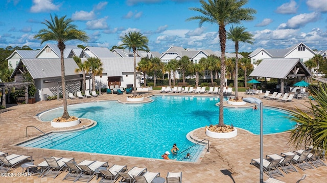 view of swimming pool featuring a patio and a gazebo